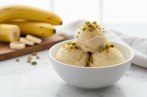 Homemade zero-oil banana ice cream scoops with cardamom and pistachios — healthy Indian dessert recipe