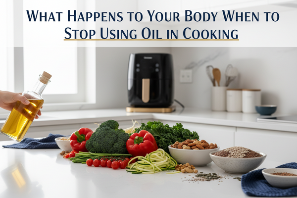 A cooking oil bottle pushed aside next to fresh vegetables, nuts, seeds and an air fryer — representing the health benefits of oil-free cooking